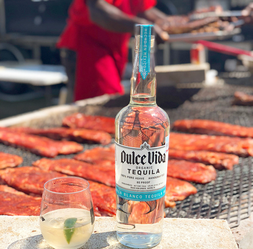 Tequila, DULCE VIDA BLANCO BOTTLE AND GLASS WITH FOOD IN BACKGROUND - Wine4Food